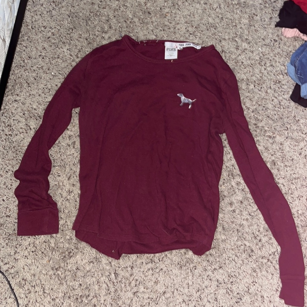 Pink long sleeved t shirt.